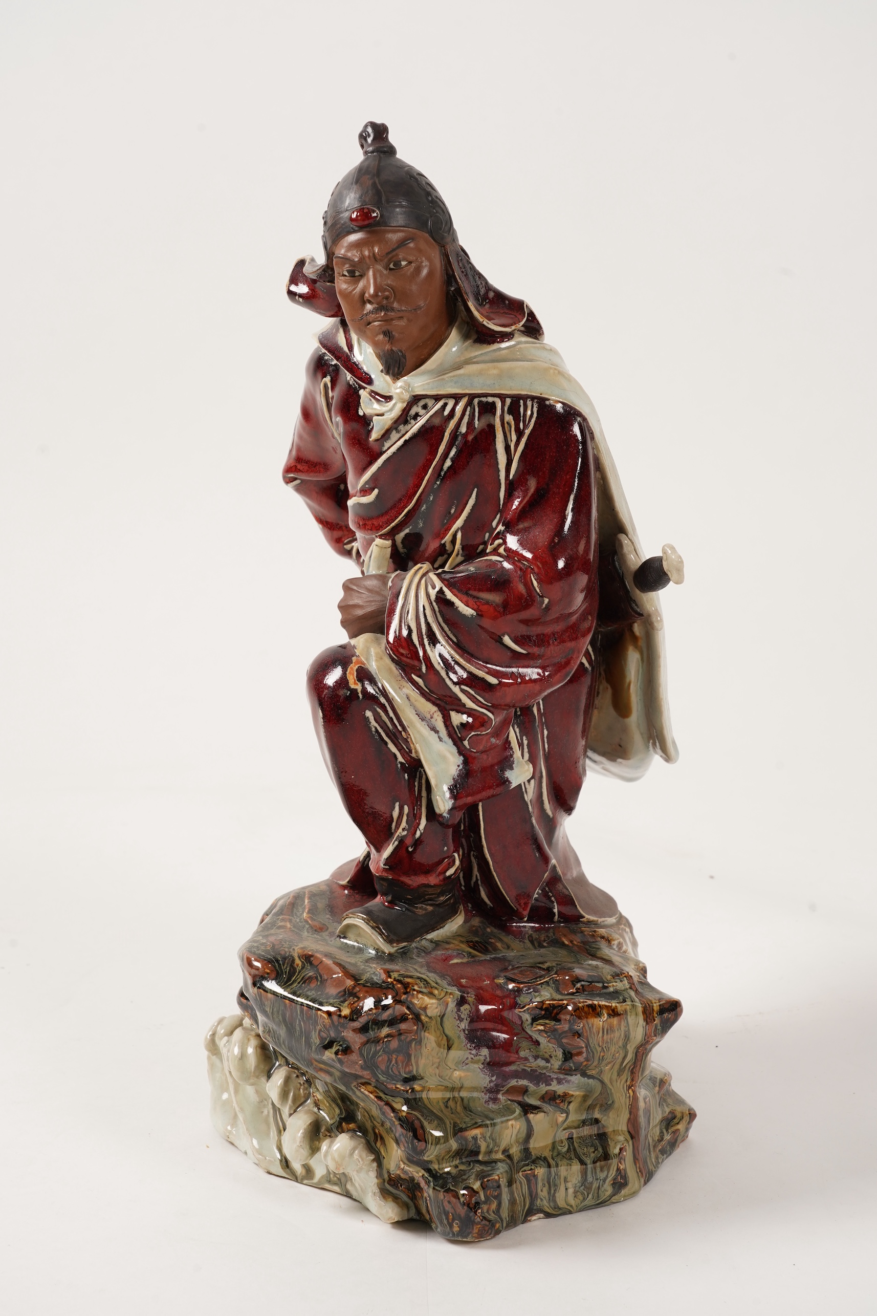 A large Chinese Shiwan stoneware figure of a warrior, 20th century